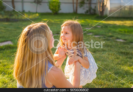 To use this stock image in your creative project, please select the size you need over to the right and click the "Add to Cart" button.
Your downloaded image will come with the Cutcaster watermark removed so don’t worry about the watermark you see on this page. Portrait of happy loving mother and her baby daughter playing outdoors stock photo, Portrait of happy loving mother and her baby outdoors by Satura86