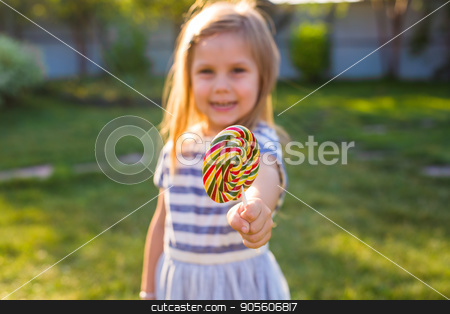To use this stock image in your creative project, please select the size you need over to the right and click the "Add to Cart" button.
Your downloaded image will come with the Cutcaster watermark removed so don’t worry about the watermark you see on this page. Funny child with candy lollipop, happy little girl eating big sugar lollipop, kid eat sweets stock photo, Funny child with candy lollipop, happy little girl eating big sugar lollipop, kid eat sweets by Satura86