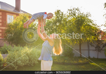 To use this stock image in your creative project, please select the size you need over to the right and click the "Add to Cart" button.
Your downloaded image will come with the Cutcaster watermark removed so don’t worry about the watermark you see on this page. happy harmonious family outdoors. mother throws baby up, laughing and playing in the summer on the nature stock photo, happy harmonious family outdoors. mother throws baby up, laughing and playing in the summer on the nature by Satura86