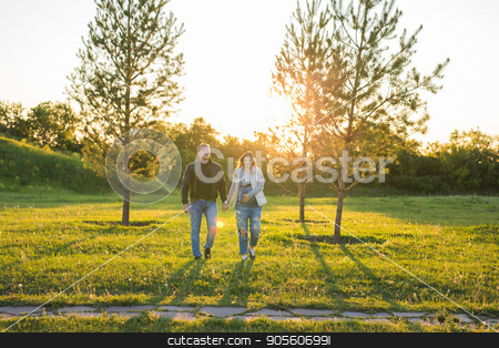 To use this stock image in your creative project, please select the size you need over to the right and click the "Add to Cart" button.
Your downloaded image will come with the Cutcaster watermark removed so don’t worry about the watermark you see on this page. Pregnant woman with husband walking on meadow in the sunlight stock photo, Pregnant woman with husband walking on meadow by Satura86