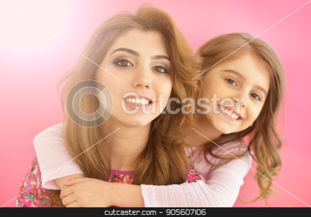 To use this stock image in your creative project, please select the size you need over to the right and click the "Add to Cart" button.
Your downloaded image will come with the Cutcaster watermark removed so don’t worry about the watermark you see on this page. young mother with little daughter stock photo, portrait of beautiful young mother with little daughter on pink background by Ruslan Huzau