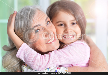 To use this stock image in your creative project, please select the size you need over to the right and click the "Add to Cart" button.
Your downloaded image will come with the Cutcaster watermark removed so don’t worry about the watermark you see on this page. little girl hugging grandmother stock photo, Portrait of a pretty little girl hugging her grandmother by Ruslan Huzau