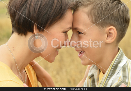To use this stock image in your creative project, please select the size you need over to the right and click the "Add to Cart" button.
Your downloaded image will come with the Cutcaster watermark removed so don’t worry about the watermark you see on this page. Mother and son standing face to face stock photo, Mother and son standing face to face outdoors by Ruslan Huzau