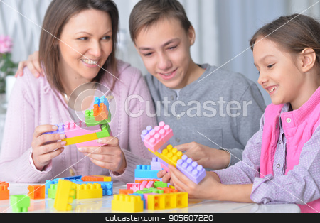 To use this stock image in your creative project, please select the size you need over to the right and click the "Add to Cart" button.
Your downloaded image will come with the Cutcaster watermark removed so don’t worry about the watermark you see on this page. family collecting blocks together stock photo, Portrait of a happy family collecting colorful blocks together by Ruslan Huzau