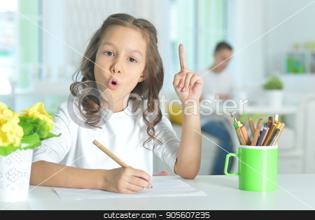 To use this stock image in your creative project, please select the size you need over to the right and click the "Add to Cart" button.
Your downloaded image will come with the Cutcaster watermark removed so don’t worry about the watermark you see on this page. little girl drawing with pencil stock photo, Cute little girl sitting at table and drawing with pencil by Ruslan Huzau