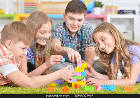 To use this stock image in your creative project, please select the size you need over to the right and click the "Add to Cart" button.
Your downloaded image will come with the Cutcaster watermark removed so don’t worry about the watermark you see on this page. Group of children playing together stock photo, Group of children playing together while lying on floor with green carpet by Ruslan Huzau
