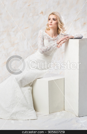 To use this stock image in your creative project, please select the size you need over to the right and click the "Add to Cart" button.
Your downloaded image will come with the Cutcaster watermark removed so don’t worry about the watermark you see on this page. fashionable wedding dress, beautiful blonde model, bride hairstyle and makeup concept - splendid young woman in luxury white gown sitting indoors on light background, female posing in the studio. stock photo, fashionable wedding dress, beautiful blonde model, bride hairstyle and makeup concept - splendid young woman in luxury white gown sitting indoors on light background, female posing in the studio by Dmitry