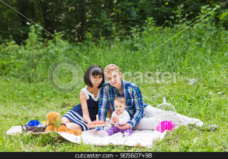 To use this stock image in your creative project, please select the size you need over to the right and click the "Add to Cart" button.
Your downloaded image will come with the Cutcaster watermark removed so don’t worry about the watermark you see on this page. Family on picnic at sunny day stock photo, Family on picnic at sunny day. Happy Mixed Race Family Having a Picnic and Playing In The Park by Satura86