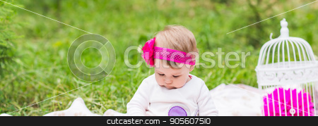 To use this stock image in your creative project, please select the size you need over to the right and click the "Add to Cart" button.
Your downloaded image will come with the Cutcaster watermark removed so don’t worry about the watermark you see on this page. baby girl playing on the green grass, family picnic close-up stock photo, baby girl playing on the green grass, family picnic close-up by Satura86