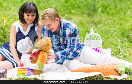 To use this stock image in your creative project, please select the size you need over to the right and click the "Add to Cart" button.
Your downloaded image will come with the Cutcaster watermark removed so don’t worry about the watermark you see on this page. Family picnicking outdoors with their cute daughter stock photo, Family picnicking outdoors with their cute daughter by Satura86