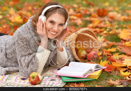 To use this stock image in your creative project, please select the size you need over to the right and click the "Add to Cart" button.
Your downloaded image will come with the Cutcaster watermark removed so don’t worry about the watermark you see on this page. young woman resting in park stock photo, Beautiful young woman resting in autumnal park by Ruslan Huzau