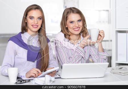 To use this stock image in your creative project, please select the size you need over to the right and click the "Add to Cart" button.
Your downloaded image will come with the Cutcaster watermark removed so don’t worry about the watermark you see on this page. Two girls in relax process stock photo, Young girls with touchpad looking at camera during work in office by Ruslan Huzau