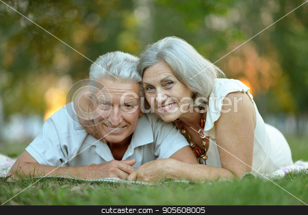To use this stock image in your creative project, please select the size you need over to the right and click the "Add to Cart" button.
Your downloaded image will come with the Cutcaster watermark removed so don’t worry about the watermark you see on this page. senior couple resting outdoors stock photo, Portrait of a happy senior couple resting outdoors by Ruslan Huzau