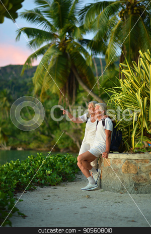 To use this stock image in your creative project, please select the size you need over to the right and click the "Add to Cart" button.
Your downloaded image will come with the Cutcaster watermark removed so don’t worry about the watermark you see on this page. Senior couple resting outdoors stock photo, Portrait of a happy senior couple resting outdoors by Ruslan Huzau