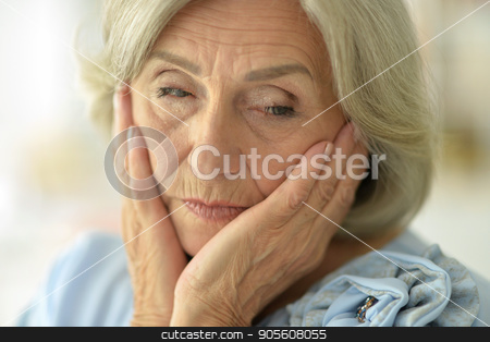To use this stock image in your creative project, please select the size you need over to the right and click the "Add to Cart" button.
Your downloaded image will come with the Cutcaster watermark removed so don’t worry about the watermark you see on this page. Beautiful sad elderly woman close-up stock photo, Portrait of a beautiful sad elderly woman close-up by Ruslan Huzau
