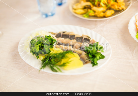 To use this stock image in your creative project, please select the size you need over to the right and click the "Add to Cart" button.
Your downloaded image will come with the Cutcaster watermark removed so don’t worry about the watermark you see on this page. Dish with sliced fish products on the festive table stock photo, Dish with sliced fish products on the festive table by Satura86