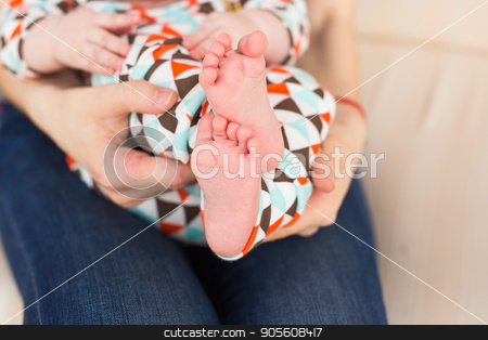 To use this stock image in your creative project, please select the size you need over to the right and click the "Add to Cart" button.
Your downloaded image will come with the Cutcaster watermark removed so don’t worry about the watermark you see on this page. baby feet in mother hands close-up stock photo, baby feet in mother hands. Infant baby boy by Satura86