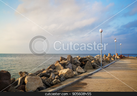 To use this stock image in your creative project, please select the size you need over to the right and click the "Add to Cart" button.
Your downloaded image will come with the Cutcaster watermark removed so don’t worry about the watermark you see on this page. Breakwater with lampposts stock photo, Breakwater with lampposts. Pierce with boulders on the Black Sea coast. Summer day. by Veresovich
