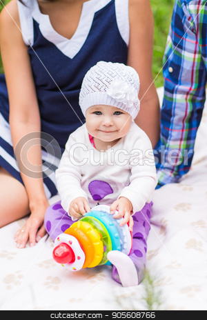 To use this stock image in your creative project, please select the size you need over to the right and click the "Add to Cart" button.
Your downloaded image will come with the Cutcaster watermark removed so don’t worry about the watermark you see on this page. baby and mother and father playing on the green grass, family picnic close-up stock photo, baby and mother and father playing on the green grass, family picnic by Satura86