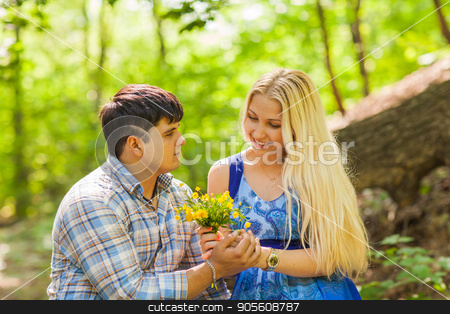 To use this stock image in your creative project, please select the size you need over to the right and click the "Add to Cart" button.
Your downloaded image will come with the Cutcaster watermark removed so don’t worry about the watermark you see on this page. Young man giving a flower dandelion to girlfriend outdoors stock photo, Young man giving a flower dandelion to girlfriend outdoors by Satura86