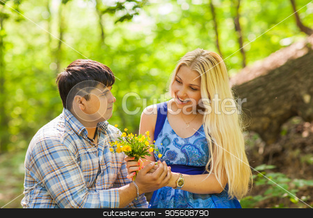 To use this stock image in your creative project, please select the size you need over to the right and click the "Add to Cart" button.
Your downloaded image will come with the Cutcaster watermark removed so don’t worry about the watermark you see on this page. Young man giving a flower dandelion to girlfriend outdoors stock photo, Young man giving a flower dandelion to girlfriend outdoors by Satura86