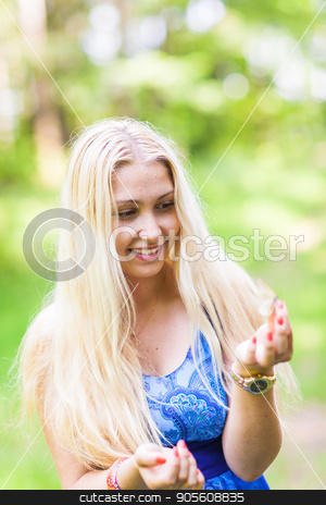 To use this stock image in your creative project, please select the size you need over to the right and click the "Add to Cart" button.
Your downloaded image will come with the Cutcaster watermark removed so don’t worry about the watermark you see on this page. Woman playing with a butterfly stock photo, Woman playing with a butterfly in summer nature by Satura86