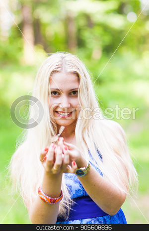 To use this stock image in your creative project, please select the size you need over to the right and click the "Add to Cart" button.
Your downloaded image will come with the Cutcaster watermark removed so don’t worry about the watermark you see on this page. Woman playing with a butterfly stock photo, Woman playing with a butterfly in summer nature by Satura86