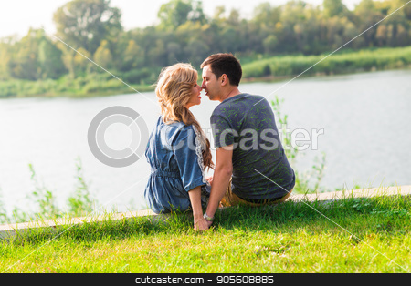To use this stock image in your creative project, please select the size you need over to the right and click the "Add to Cart" button.
Your downloaded image will come with the Cutcaster watermark removed so don’t worry about the watermark you see on this page. A young couple is romantic in the park on a lake. Man and woman sit in the summer sun in the green grass stock photo, A young couple is romantic in the park on a lake. Man and woman sit in the summer sun in the green grass by Satura86