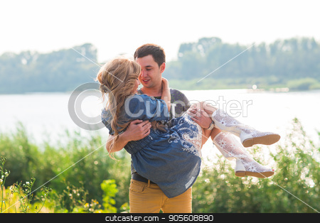 To use this stock image in your creative project, please select the size you need over to the right and click the "Add to Cart" button.
Your downloaded image will come with the Cutcaster watermark removed so don’t worry about the watermark you see on this page. Man holding woman in his arms on the beach of the river on a sunny day stock photo, Man holding woman in his arms on the beach of the river on a sunny day by Satura86