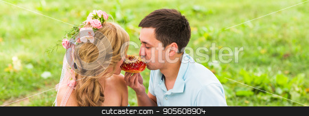 To use this stock image in your creative project, please select the size you need over to the right and click the "Add to Cart" button.
Your downloaded image will come with the Cutcaster watermark removed so don’t worry about the watermark you see on this page. Young funny love couple on date in nature picnic with donuts stock photo, Young funny love couple on date in nature picnic with donuts by Satura86