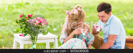 To use this stock image in your creative project, please select the size you need over to the right and click the "Add to Cart" button.
Your downloaded image will come with the Cutcaster watermark removed so don’t worry about the watermark you see on this page. Happy Couple Having Romantic Picnic. Focus on flowers. selective focuse stock photo, Happy Couple Having Romantic Picnic in Countryside by Satura86