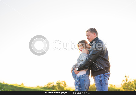 To use this stock image in your creative project, please select the size you need over to the right and click the "Add to Cart" button.
Your downloaded image will come with the Cutcaster watermark removed so don’t worry about the watermark you see on this page. Happy young pregnant couple hugging in nature stock photo, Happy and young pregnant couple hugging in nature by Satura86