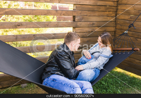 To use this stock image in your creative project, please select the size you need over to the right and click the "Add to Cart" button.
Your downloaded image will come with the Cutcaster watermark removed so don’t worry about the watermark you see on this page. happy pregnant couple sitting in hammock - family, parenthood and happiness concept stock photo, happy pregnant couple sitting in hammock - family, parenthood and happiness concept by Satura86