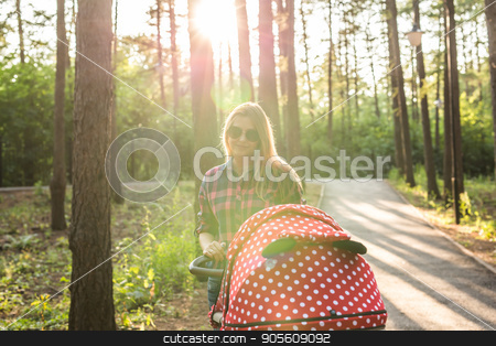 To use this stock image in your creative project, please select the size you need over to the right and click the "Add to Cart" button.
Your downloaded image will come with the Cutcaster watermark removed so don’t worry about the watermark you see on this page. Mother walking with a stroller in the park stock photo, Mother walking while pushing a stroller in the park by Satura86