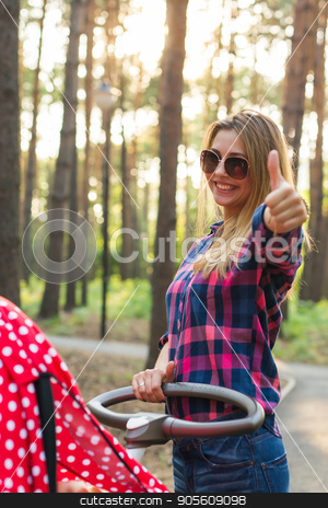 To use this stock image in your creative project, please select the size you need over to the right and click the "Add to Cart" button.
Your downloaded image will come with the Cutcaster watermark removed so don’t worry about the watermark you see on this page. Happy motherhood concept - Woman with pram showing thumbs up outdoors stock photo, Happy motherhood concept - Woman with pram showing thumbs up outdoors by Satura86