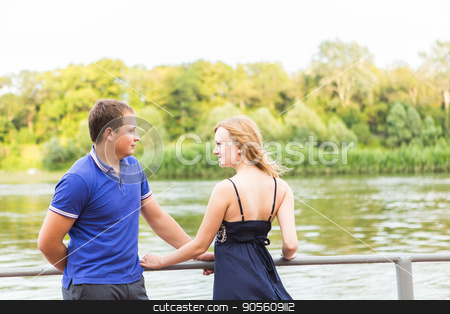 To use this stock image in your creative project, please select the size you need over to the right and click the "Add to Cart" button.
Your downloaded image will come with the Cutcaster watermark removed so don’t worry about the watermark you see on this page. young couple in love near the lake stock photo, young couple in love near the lake by Satura86