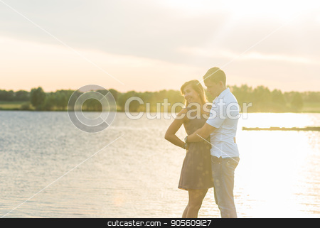 To use this stock image in your creative project, please select the size you need over to the right and click the "Add to Cart" button.
Your downloaded image will come with the Cutcaster watermark removed so don’t worry about the watermark you see on this page. Young couple in love outdoors embracing and laughing together at lake stock photo, Young couple in love outdoors embracing and laughing together at lake by Satura86