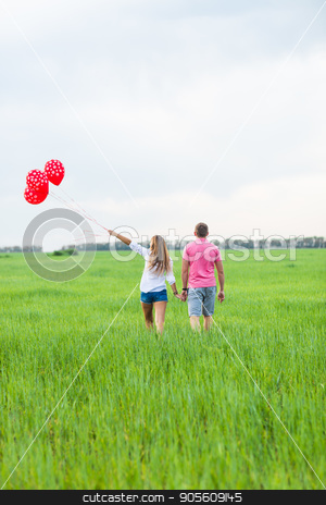 To use this stock image in your creative project, please select the size you need over to the right and click the "Add to Cart" button.
Your downloaded image will come with the Cutcaster watermark removed so don’t worry about the watermark you see on this page. beautiful young couple hugging and kissing in a field with colored balloons, rear view stock photo, beautiful young couple hugging and kissing in a field with colored balloons by Satura86