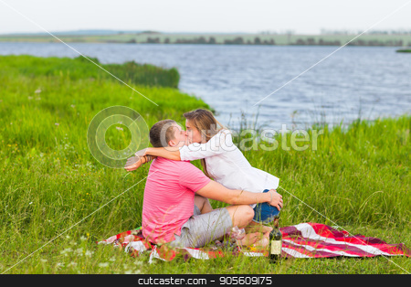 To use this stock image in your creative project, please select the size you need over to the right and click the "Add to Cart" button.
Your downloaded image will come with the Cutcaster watermark removed so don’t worry about the watermark you see on this page. Young couple in summer meadow, man and woman having romantic picnic stock photo, Young couple in summer meadow, man and woman having romantic picnic by Satura86