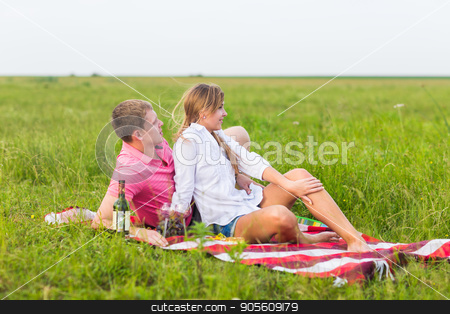 To use this stock image in your creative project, please select the size you need over to the right and click the "Add to Cart" button.
Your downloaded image will come with the Cutcaster watermark removed so don’t worry about the watermark you see on this page. Young couple in summer meadow, man and woman having romantic picnic stock photo, Young couple in summer meadow, man and woman having romantic picnic by Satura86