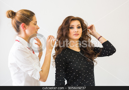 To use this stock image in your creative project, please select the size you need over to the right and click the "Add to Cart" button.
Your downloaded image will come with the Cutcaster watermark removed so don’t worry about the watermark you see on this page. Make-up Artist and Beautiful Fashion Model stock photo, Make-up Artist and Beautiful Fashion Model in salon by Satura86