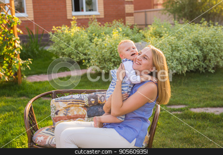 To use this stock image in your creative project, please select the size you need over to the right and click the "Add to Cart" button.
Your downloaded image will come with the Cutcaster watermark removed so don’t worry about the watermark you see on this page. Happy mother holding a young son in the park stock photo, Happy mother holding a young son in the park by Satura86