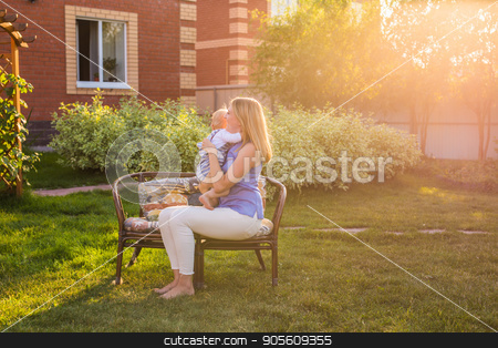 To use this stock image in your creative project, please select the size you need over to the right and click the "Add to Cart" button.
Your downloaded image will come with the Cutcaster watermark removed so don’t worry about the watermark you see on this page. happy family mother and baby hugging and kiss in summer on the nature stock photo, happy family mother and baby hugging and kiss in summer on the nature by Satura86