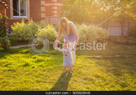 To use this stock image in your creative project, please select the size you need over to the right and click the "Add to Cart" button.
Your downloaded image will come with the Cutcaster watermark removed so don’t worry about the watermark you see on this page. beautiful mother is walking on with her little baby boy son with first steps stock photo, beautiful mother is walking on with her little baby boy son with first steps by Satura86