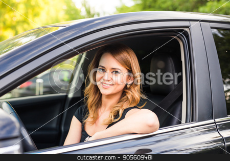 To use this stock image in your creative project, please select the size you need over to the right and click the "Add to Cart" button.
Your downloaded image will come with the Cutcaster watermark removed so don’t worry about the watermark you see on this page. Portrait of smiling young woman driving a car stock photo, Portrait of smiling young african american woman driving a car by Satura86