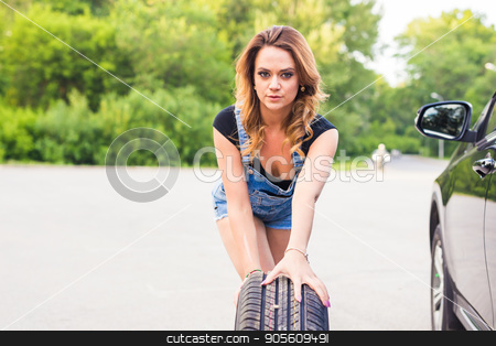 To use this stock image in your creative project, please select the size you need over to the right and click the "Add to Cart" button.
Your downloaded image will come with the Cutcaster watermark removed so don’t worry about the watermark you see on this page. Sexy woman changing wheel on a roadside stock photo, Sexy woman changing wheel on a roadside by Satura86
