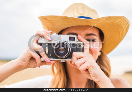 To use this stock image in your creative project, please select the size you need over to the right and click the "Add to Cart" button.
Your downloaded image will come with the Cutcaster watermark removed so don’t worry about the watermark you see on this page. Woman holding retro camera close-up stock photo, Woman holding retro camera in the field by Satura86