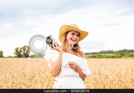 To use this stock image in your creative project, please select the size you need over to the right and click the "Add to Cart" button.
Your downloaded image will come with the Cutcaster watermark removed so don’t worry about the watermark you see on this page. Woman holding retro camera stock photo, Woman holding retro camera in the field by Satura86