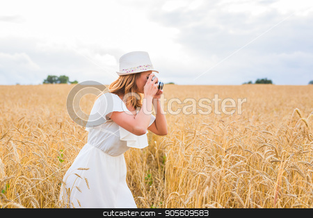 To use this stock image in your creative project, please select the size you need over to the right and click the "Add to Cart" button.
Your downloaded image will come with the Cutcaster watermark removed so don’t worry about the watermark you see on this page. Pretty girl with vintage camera outdoors stock photo, Pretty girl with vintage camera outdoors in nature by Satura86