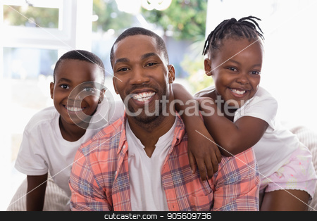 To use this stock image in your creative project, please select the size you need over to the right and click the "Add to Cart" button.
Your downloaded image will come with the Cutcaster watermark removed so don’t worry about the watermark you see on this page. Cheerful father and children sitting on couch at home stock photo, Portrait of cheerful father and children sitting on couch at home by Wavebreak Media